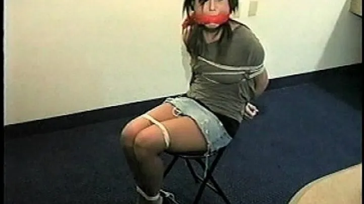 TAG Leslie 1- Hand Gagged, Mouth Packed, Thick Red Cleave Gag, Chair Tied, Denim Miniskirt