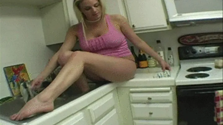 Busty blonde washes her nasty feet