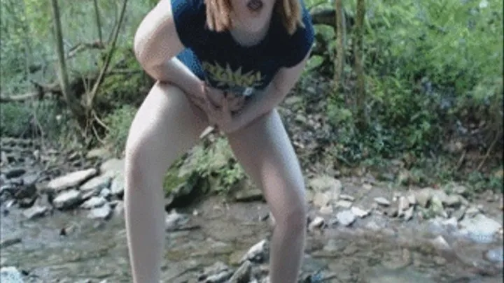 Shy girl goes pee in the woods