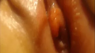 Extreme closeup of urethra while peeing