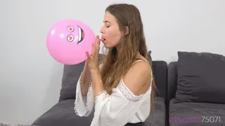 Cute Michelle is blowing up small party balloons ( quality)