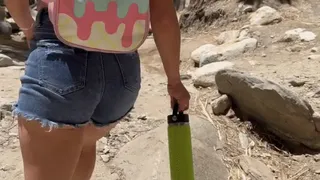 Cutie in booty shorts hikes through desert paradise
