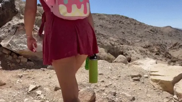 Teenage girl hiking up skirt