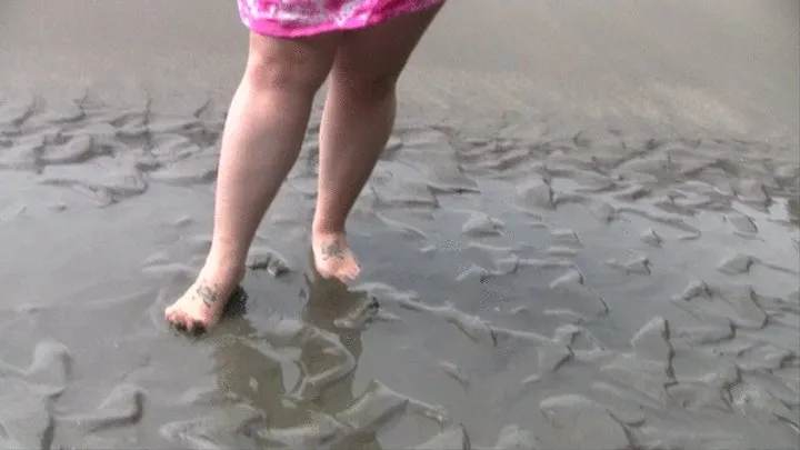 BBW Bella Bendz is jumping around in the water barefoot splashing around