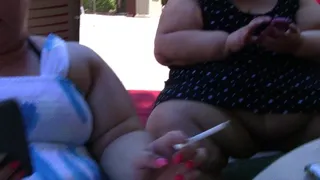 BBW Bella Bendz sitting by the pool enjoying a cigarette