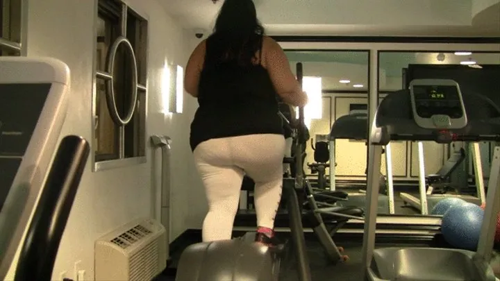 BBW Juicy Jazmynne is working out in the gym belly shaking big thighs riding the bike and lifting weights