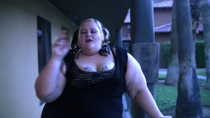 BBW Airabella smoking a cigarette in pigtails outside the hotel