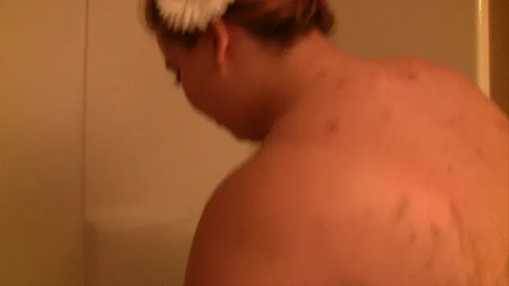 Minnie Mayhem is taking a shower and washing her huge tits hair and body