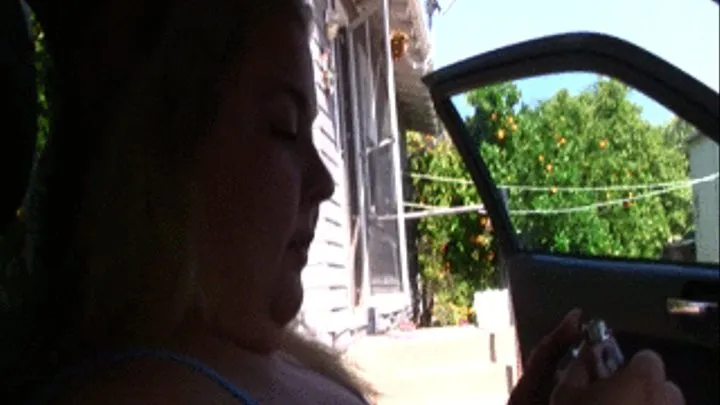 BBW Lola LoveBug is sitting in the car smoking and eating some snacks