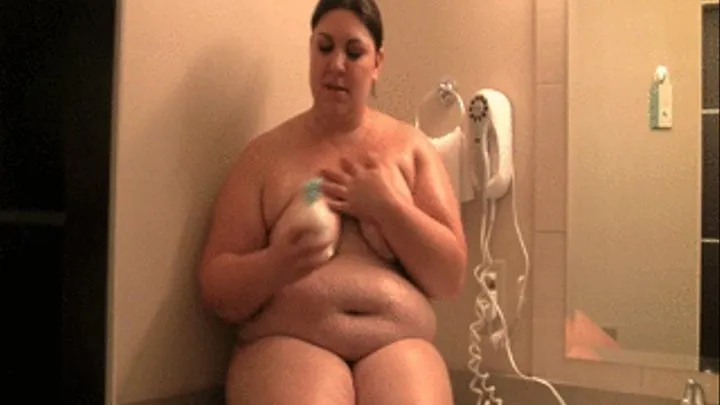 Bella Bendz puts oil all over her big tits huge belly thighs and legs in the bathroom