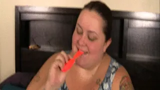 SSBBW Monika Mynx is blowing balloons on the bed and she is getting bigger by each balloon as they get stuffed under her dress