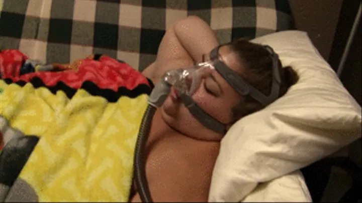 BBW Lola Love Bug is napping and snoring while wearing her breathing mask in bed