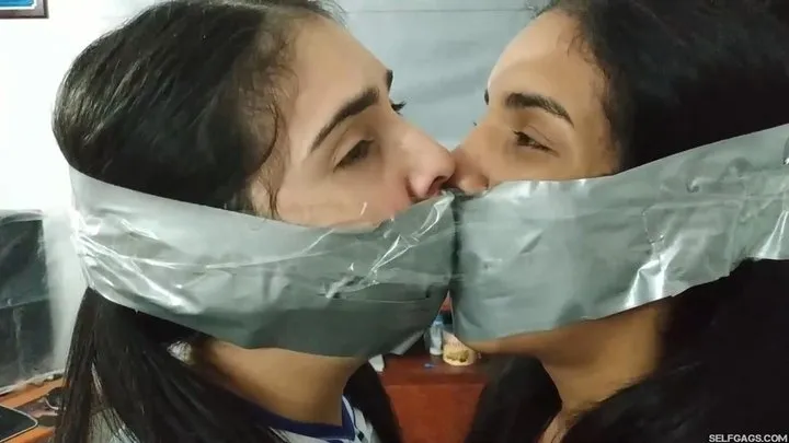 Tied Up Cheerleader Rivals United in a Tape Gagged Kiss