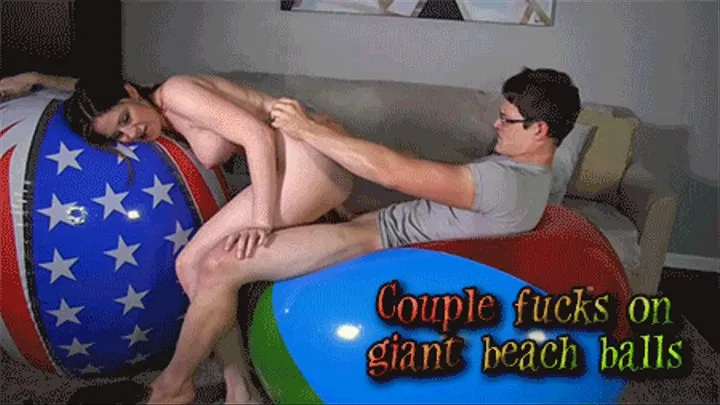Couple fucks on giant beach balls [ ]