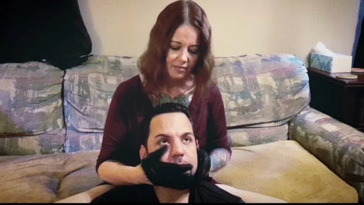 Her gloves on his face