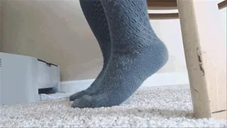 Rubbing Feet in socks against carpet