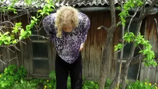 Thick girl pissing standing outdoors.