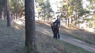 Man mocks fat girl in the woods and tie her to a tree.