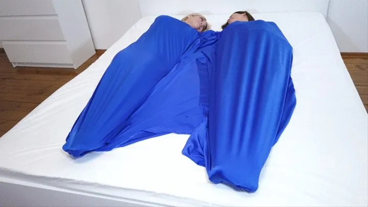 Two Girls and Blue Spandex Sheet