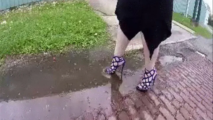 Slow motion wet blue heels.