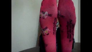 Monique size 11 feet in pink socks (removes them later)