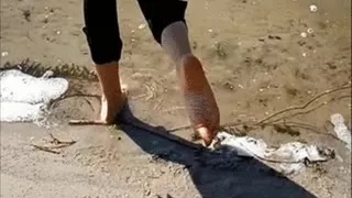 Feet in the sand and water