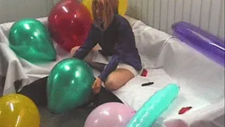 Cathy playes with huge shiny balloons