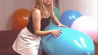 Cathy rides a huge blue balloon tube