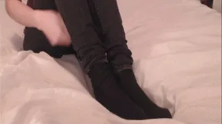 Taking off my worn black socks