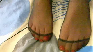 Red toes in black thin pantyhose