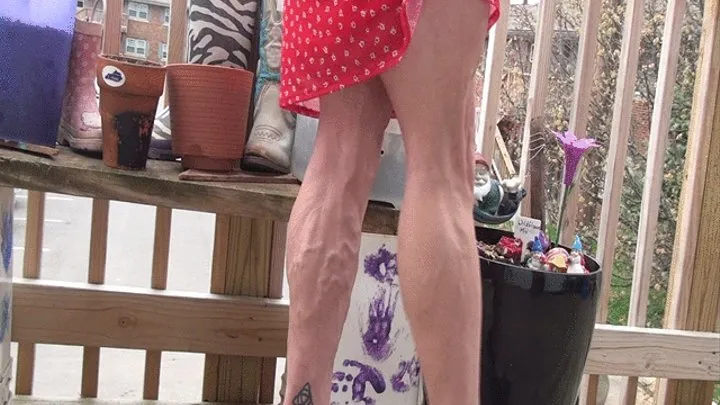 Tempest flexing in red floral dress and heels