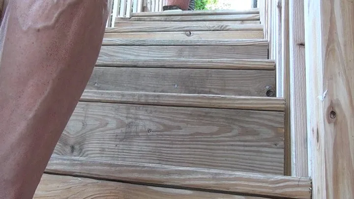 TEmpest bare foot on wooden stairs