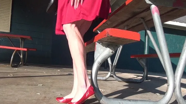 Tempest in red flats and flexing calves hard