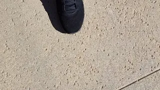 Tempest walking in black sneakers