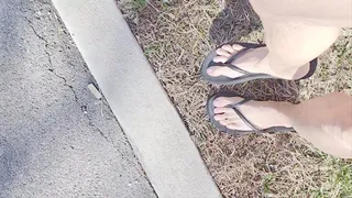 Walking around in black thong flip flops