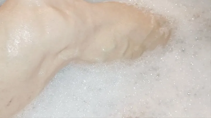 Taking a bubble bath and flexing