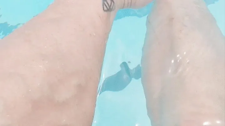 Tempest using phone to film calves while in pool