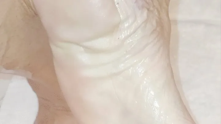 POV oiled legs and feet