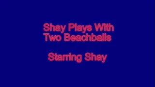 Shay Plays With Two Beach Balls