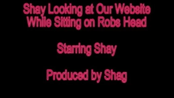 Shay Sitting on Robs Head Looking at the Website