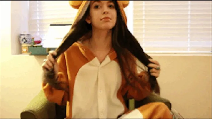 Long brown hair brushing in bear onesie