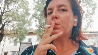 Smoking in a public park sexy Italian stepmother