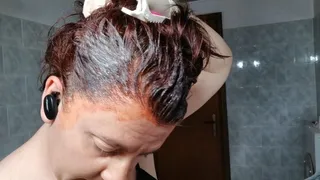 Super red hair dye with white latex gloves