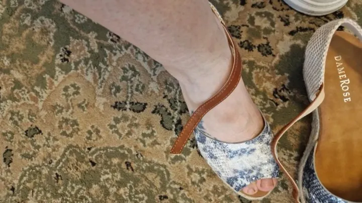 In a shoe store I try on some high sandals with sweaty, dirty feet