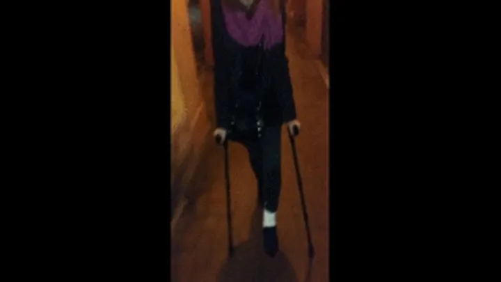 WALKING ON THE STREET WITH CRUTCHES