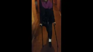 WALKING ON THE STREET WITH CRUTCHES