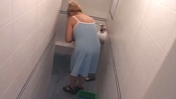 Blonde mature gets fucked in the toilet by two guys