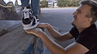 Hands trampled under VANS in the skate park