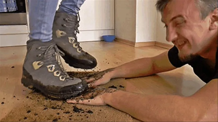 Trampling his hands with muddy hiking boots