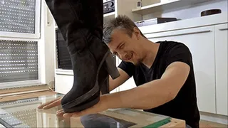 Crushing his hands under my boot soles